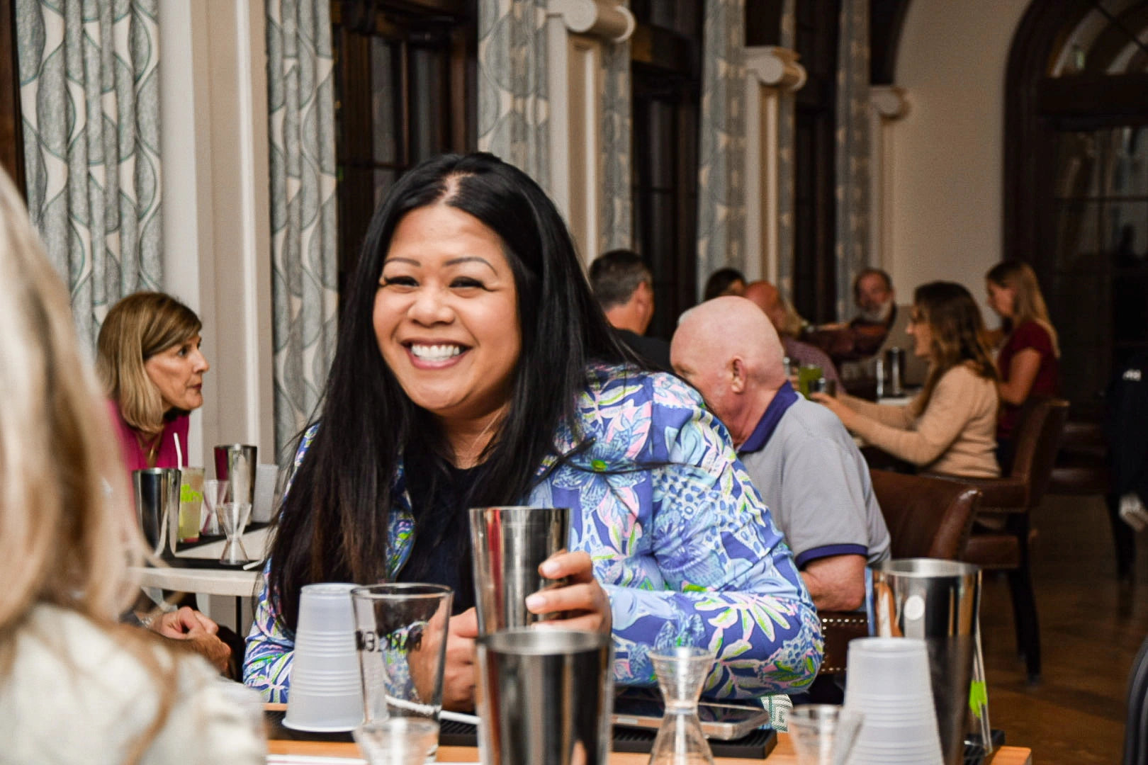 Women smiling at mixology 